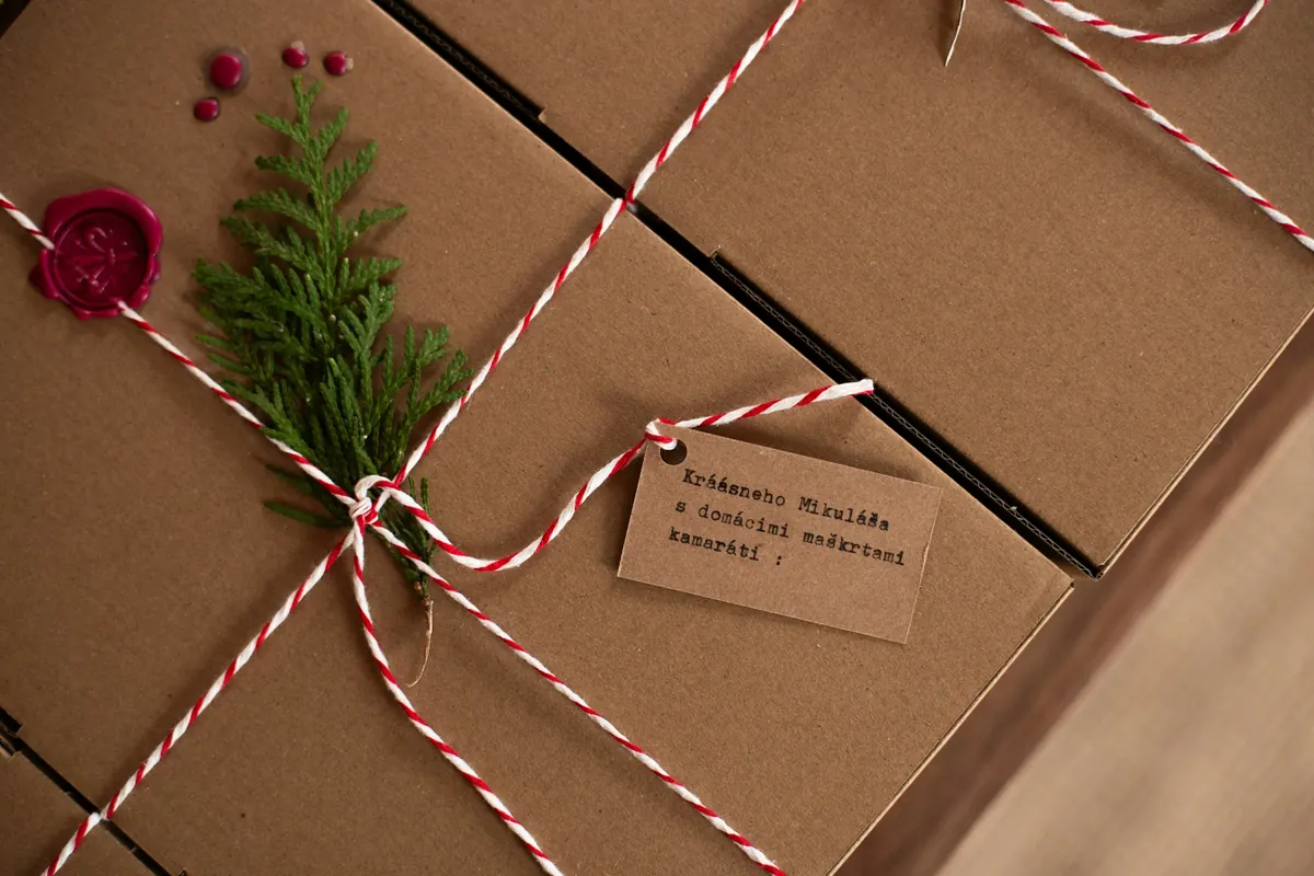 Brown paper parcels tied with red and white string and a handwritten tag